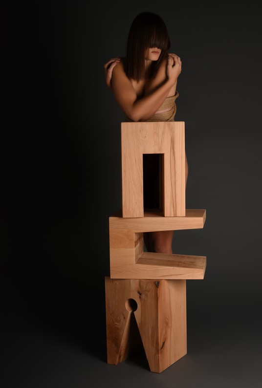 stools_lady behind 3 stools one on top of other